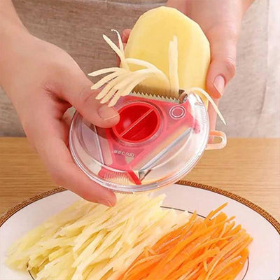 une personne qui utilise un eplucheur rouge pour eplucher une patate en batonnets fins